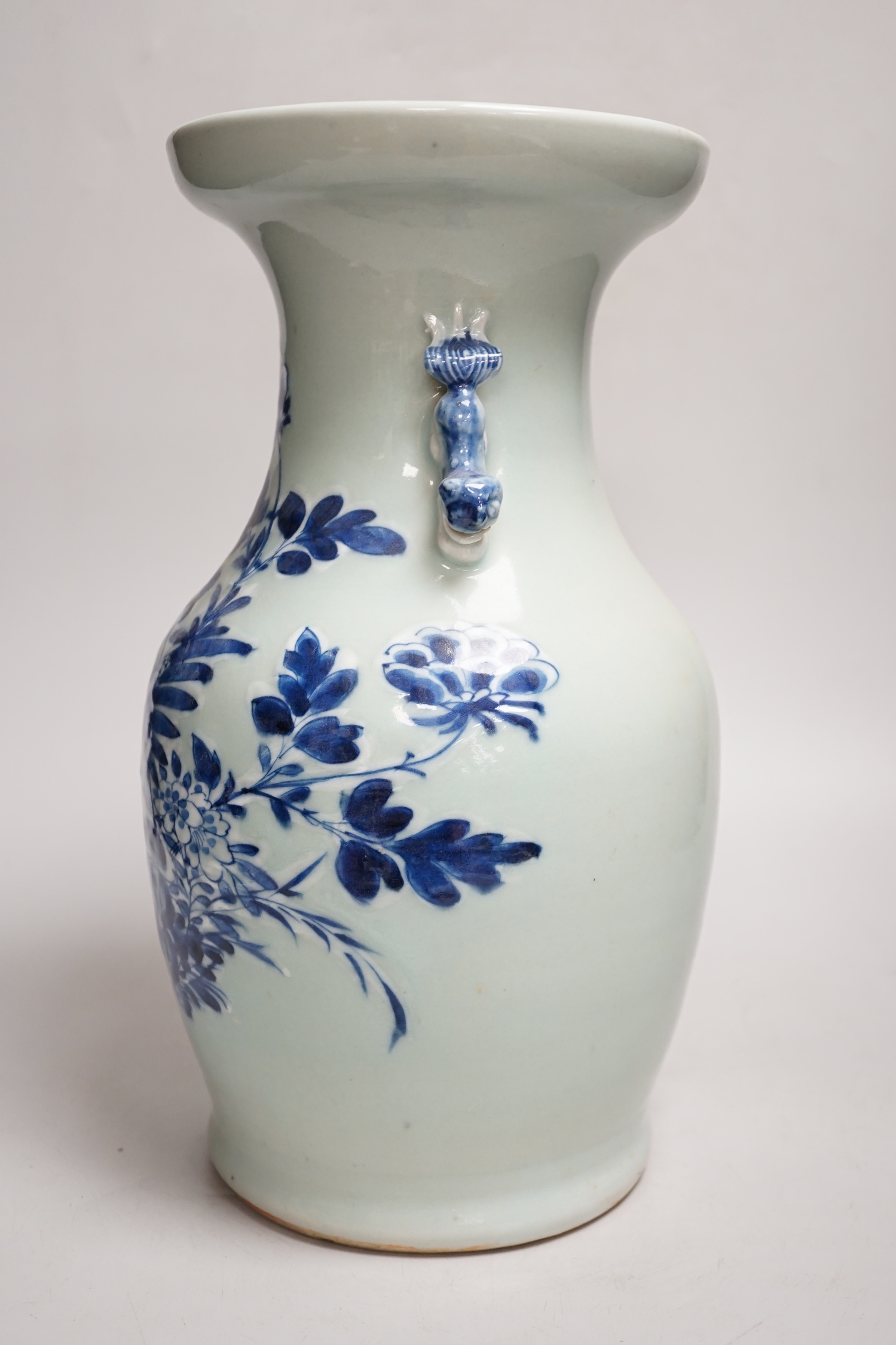 A Chinese celadon ground underglaze blue baluster vase, early 20th century, 34cm